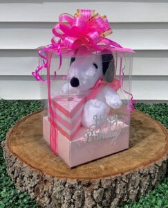 Soft Plushie gift box and chocolates with a happy birthday sign and big gift bow